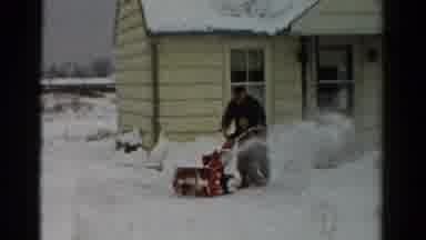 Toledo Ohio USA (1954): Man Pushing Red Snowblower Blowing Snow In Air In Snow