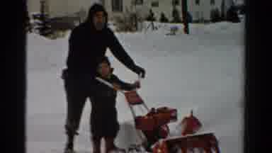 Toledo Ohio USA (1954): Little Boy Helping His Father Push A Snow Blower Clearing