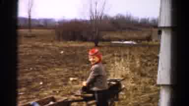 Toledo Ohio USA (1954): Little Boy In Cold Weather On A Field Helping Out