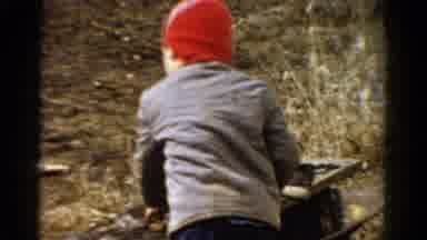 Toledo Ohio USA (1954): A Kid Playing On A Cold Autumn Day Attempts To Take