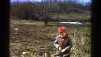 Toledo Ohio USA (1954): Little Boy Eating Gum And Playing On A Bright Day Light