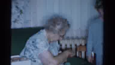 Toledo Ohio USA (1954): A Lady Sitting On A Couch And Messing With Couch