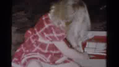 Toledo Ohio USA (1954): Girl Wearing Red Dress Colors On Floor While Boy Wearing