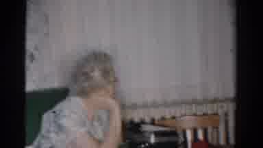 Toledo Ohio USA (1954): Woman Wearing Blue Dress And Glasses Looks At Man Wearing