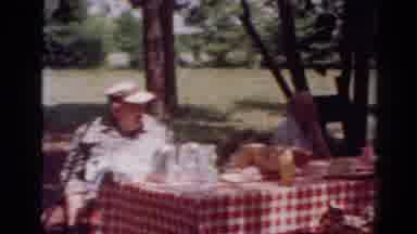 Toledo Ohio USA (1954): Older Couple Sitting Outside At A Picnic Table Enjoying