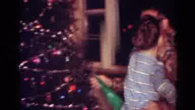 Toledo Ohio USA (1954): Man Wearing Glasses Hugs Boy Wearing Blue Shirt Next To