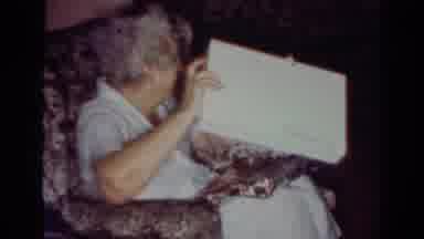 Toledo Ohio USA (1954): The Old Woman In The Glasses Sitting On The Couch Opening