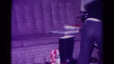 Toledo Ohio USA (1954): Two Kids Pick Up Christmas Presents From Under The Tree
