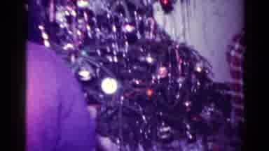 Toledo Ohio USA (1954): Teens Handing Out Christmas Presents And Opening A Box