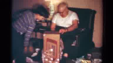 Toledo Ohio USA (1954): Young Boy Helps A Older Man Open Up A Large Christmas Gift