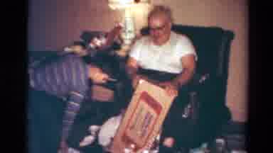 Toledo Ohio USA (1954): A Boy And A Man Opening A Box For A Holiday
