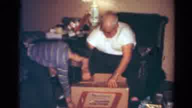 Toledo Ohio USA (1954): Grandpa And Grandson Opening A Christmas Cardboard Box