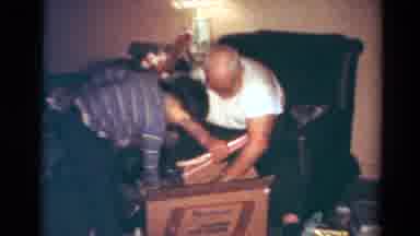 Toledo Ohio USA (1954): Young Male Child Helps Grandpa Remove Items From A