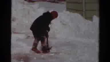 Toledo Ohio USA (1954): Young Kid Bundled Up In A Coat Hat And Gloves Working Hard
