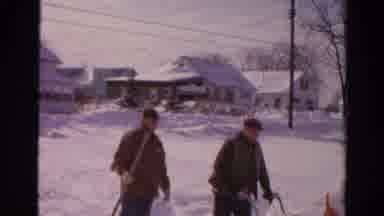 Toledo Ohio USA (1954): Two Men Working Hard With A Shovel And A Snow Blower To