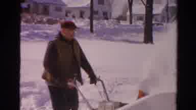Toledo Ohio USA (1954): Man Wearing Red Hat Uses Snow Blower On A Bright Sunny