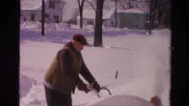 Toledo Ohio USA (1954): An Old Man Clearing Snow Using A Machine With Another