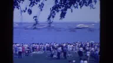 New York City (1954): A Crowd Of People Looking Out On A Large Lake