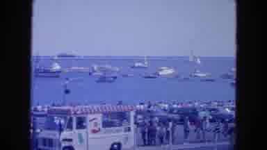 New York City (1954): A Harbor With Blue Water And Boats With A Group Of Young