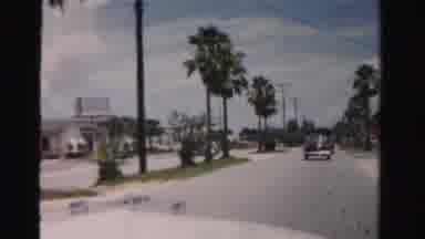 Dade County Florida (1955): Car Driving Along Road Passing Beach And Other Cars