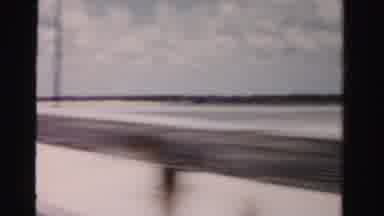 Dade County Florida (1955): Video Footage Of Someone Moving Quickly Along A Bridge