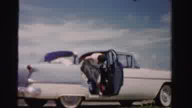 Dade County Florida (1955): Woman With Purse Exiting Back Seat Of Car And Fixing