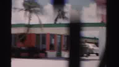 Dade County Florida (1955): Passing View Of White Buildings On A Bright Sunny Day