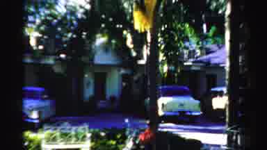 Dade County Florida (1955): Man Walking In A Residential Area And Boy Peeping At