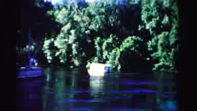 Dade County Florida (1955): Multiple Boats On The Water Moving About By A Treeline