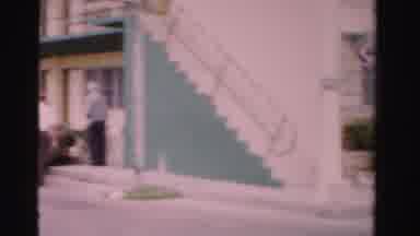 Dade County Florida (1955): Cars Parked By Green And White Building On Cloudy Day