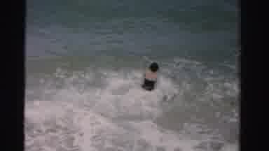 Dade County Florida (1955): A Woman Jumps In The Ocean And A Man Walks Along The
