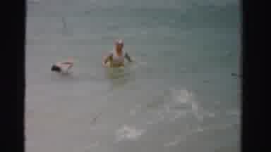 Dade County Florida (1955): Man And Woman Swimming And Playing In The Ocean With