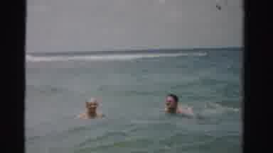 Dade County Florida (1955): Two Adult Men Swimming In The Ocean Neck Deep With