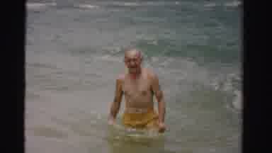 Dade County Florida (1955): Man Wades Through The Ocean Towards The Shore As