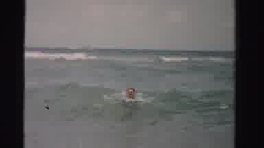 Dade County Florida (1955): Two Men Swimming In Strong Waters