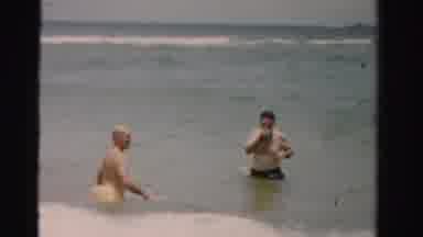 Dade County Florida (1955): Two Middle Aged Men Having Fun In The Sea Dodging