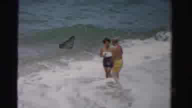 Dade County Florida (1955): A Man And Woman Playing With Each Other In The Ocean