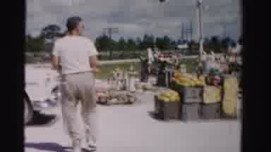 Dade County Florida (1955): Man Purchasing A Box Full Of Produce From A Roadside