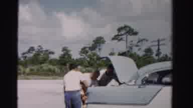 Dade County Florida-1955: Three Men Unload Groceries From The Trunk Of Their Car