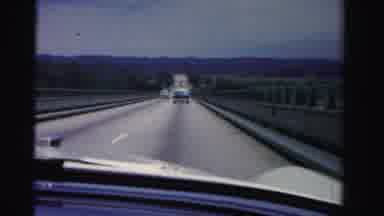 Dade County Florida (1955): Car Drives Down The Road With Cars Coming And Going On