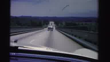 Dade County Florida (1955): Driving Down The Road While Following Another Car On A
