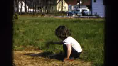 Hicksville New York (1955): A Child Plays In The Dirt Outside With A Shovel In The