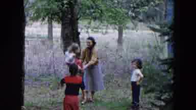 Hicksville New York (1955): Kids Swinging On A Swing With Their Mom Watching