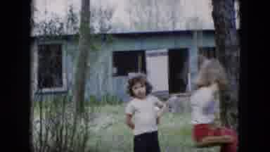 Hicksville New York (1955): Little Girls Play Outside In The Yard On The Swing And