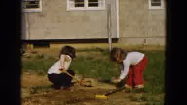 Hicksville New York (1955): Two Children Are Cleaning The Garden And Are Playing