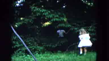 Hicksville New York (1955): Boy And A Girl In A Party Dress Playing In The Yard
