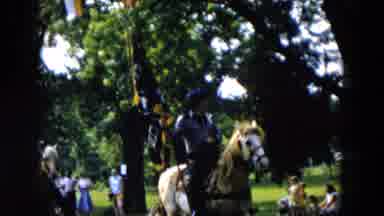 Hicksville New York (1955): Woman Wearing Grey Pants Rides Brown Horse On A Sunny
