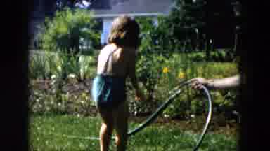 Hicksville New York (1955): A Little Girl Playing In The Garden And Pour The Water