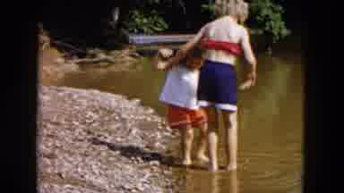 Hicksville New York (1955): The Two Children Put Their Toes In The Water And