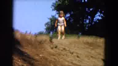 Hicksville New York (1955): One Child Running In Muddy Lake With Other Children